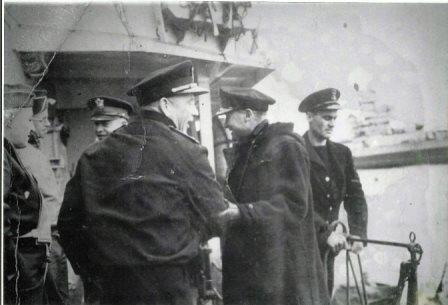 [photograph: General Eisenhower 'Ike' on D-Day plus one, going to Normandy on H.M.S. Apollo, a fast minelayer, Abdiel class. With Major General Ralph Royce, General Omar Bradley, unkonwn, RN Admiral Bertram Ramsay, and RN Petty Officer Ames on right. Courtesy: Gary Ames.