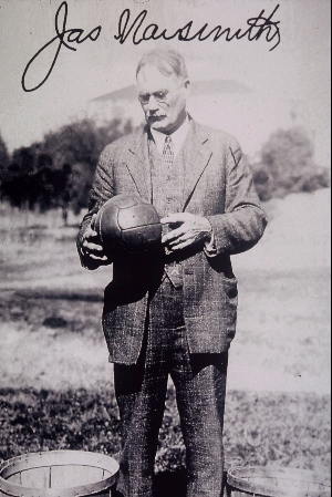 [photo: James Naismith with basketball. All rights reserved. Kansas Heritage Group.